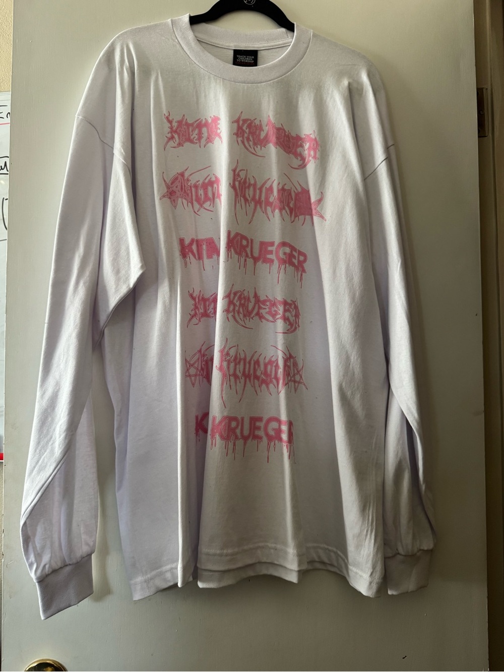 Kruger Men’s White Long-Sleeve Graphic Tee with Pink Print